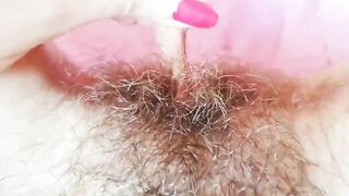 Extremely hairy pussy with big lips close-up